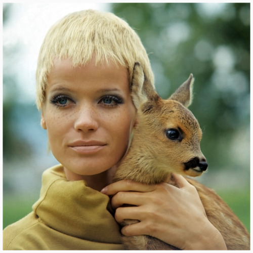 Veruschka with a few fake freckles, , holding a baby doe ,1967