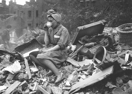 gan-edhen:   A woman drinks tea, 1940, in the aftermath of a German bombing raid