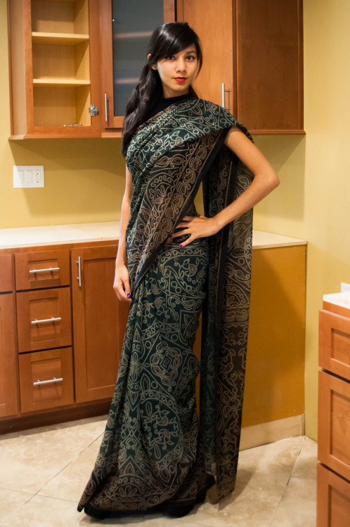 designedtoseduce:  zessinna-saris:  Dark green georgette fabric with the white and yellow design throughout the sari. It’s absolutely beautiful, and perfect for a night out or any event. Maybe even try it with a corset! A dull yellow, or silver corset,