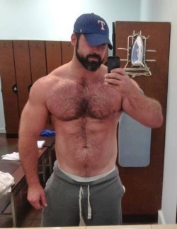 iammegadaddyissues:  It was late and i guess He thought the locker room was empty. From the shower i could see Him flexing and taking selfies and it made me giggle. He snapped around and gave me a cool hard stare. The smile vanished from my face when