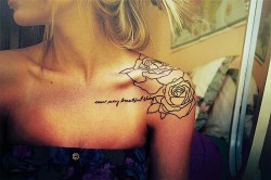 Upper arm rose tattoos for women