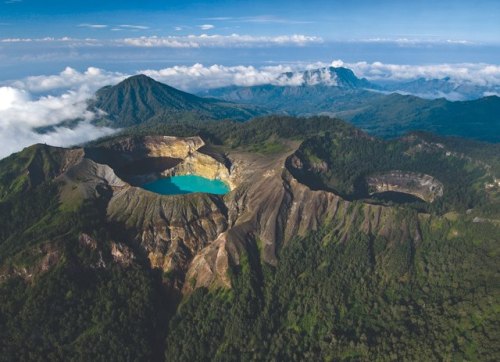 This is Mount Kelimutu in Indonesia. The volcano contains three striking summit crater lakes of vary