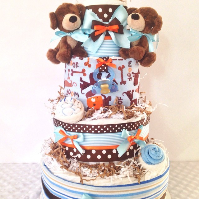 {Just Baked} Twin Boys Puppy Love Diaper Cake. So Precious!!! Loaded with tons of gifts including receiving blanket, burp cloth, socks and tons of brand name diapers!!! #alldiapercakes #baby #babyboy #babygift #diapercakes #DiaperCake #BabyShower