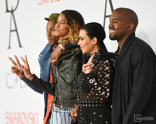 Kanye West and wife Kim Kardashian West pose with fashion icon award winner Pharrell Williams and wi