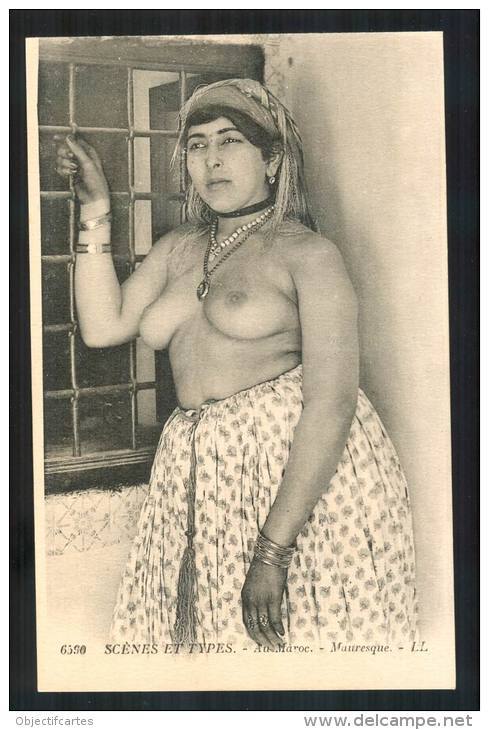   Moroccan woman. Via Delcampe.   