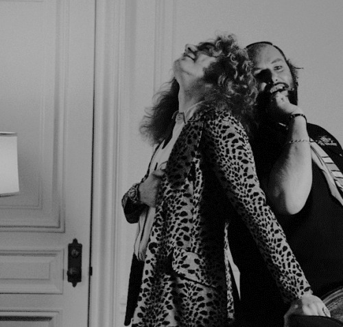 Robert Plant poses for some portraits with Peter Grant at his hotel room in New York. May 7, 1974. ©