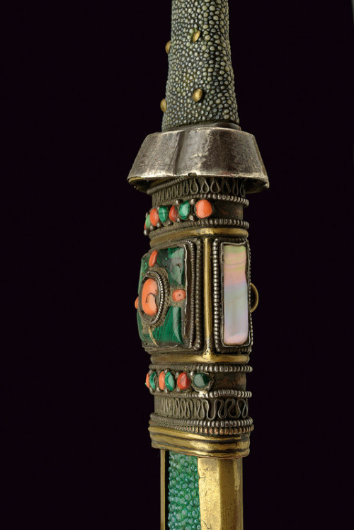 art-of-swords:  Tsep-sa Sword Dated: 19th century Culture: Tibetan Measurements: overall length 45 cm The sword features a straight, single-edged blade of typical shape, with a hollow brass quillon with external silver plating. The grip is covered with