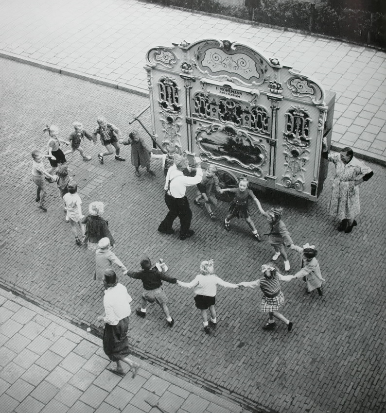 Henk Jonker. Street organ with dancing children, Amsterdam, 1950s.