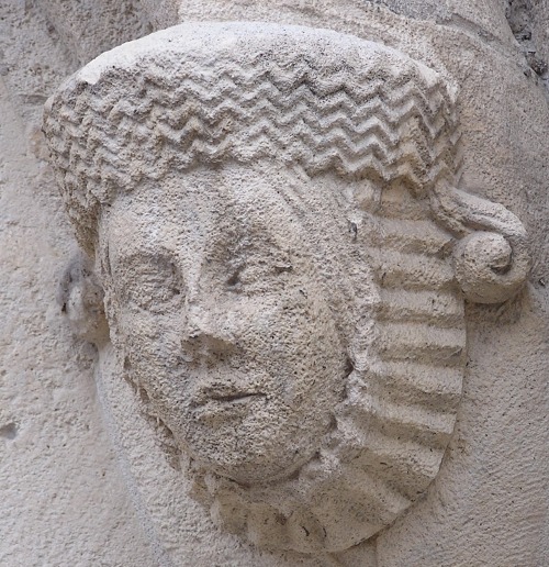 Head of a woman on the facade of Burgos Cathedral in Spain, 13th century