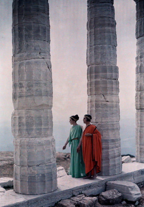 natgeofound:Two dancers in costume stand between the columns of Poseidon’s Temple, Greece, 1930. Pho