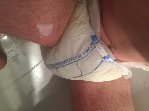 wet-diaperboy:  Abena M4 fun in the shower…you all know I like THICK diapers - is there any better way to swell the up? Haha I don’t think so. It kept my legs nicely open so I could only waddle in the shower :)