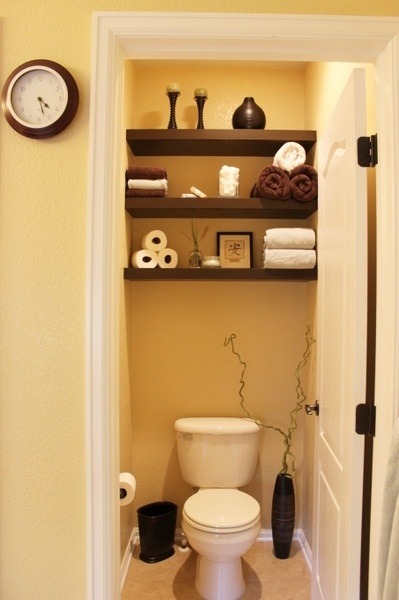 designmeetstyle:  On the Wall Storage. Take on the trend of open shelving to create a stylish and functional display for all your bath necessities. We love this beautiful vignette above the toilet.