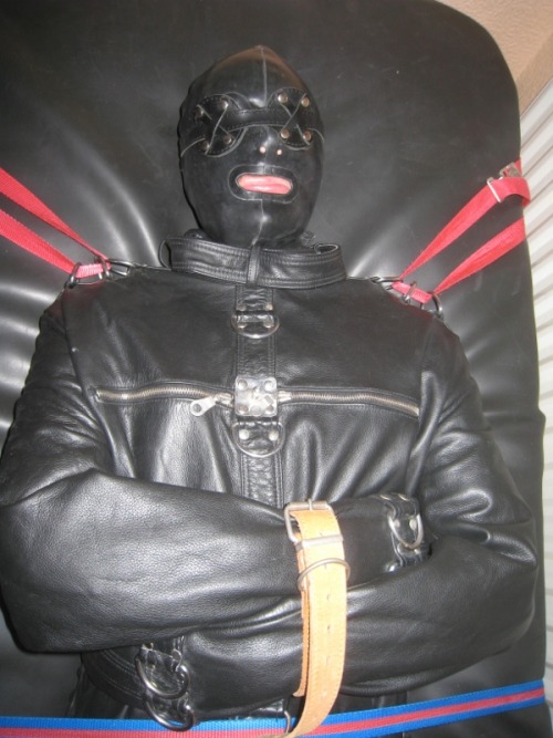 northernleather:A gimp restrained