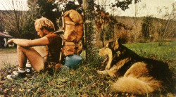 justenoughisplenty:  Exhausted after a 40-mile day, a hiker collapses against a tree. As tired as his master, lays his dog Cooper. “Time to pitch camp,” he yawns. National Geographic - April, 1977 