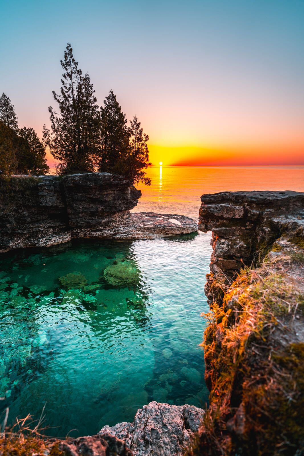 earthporn: “The crystal clear water of Lake Michigan at Cave Point Park at sunrise. [1067x1600] [OC] by: nickargiresphoto ”