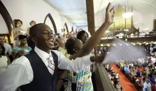 micdotcom:  Emotional photos show the first Sunday service at the Emanuel AME Church after the shootingThe church was packed to capacity; the Associated Press reported parishioners were queued in long lines to get in. Police officers were on the scene