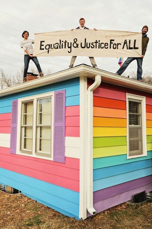 man-not-maam:  Westboro Baptist Church’s neighbors: The Equality House. One side is painted in rainbow colors, the other in trans colors. Much love to these people.