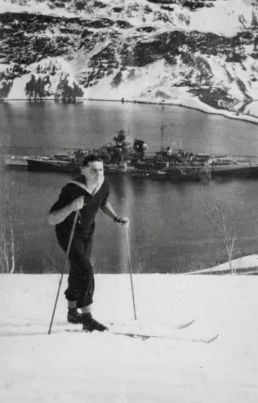 Kriegsmarineman Climbing The Fjords With Tirpitz In The Background, WWII.