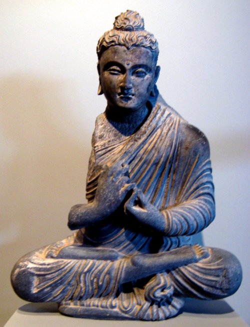 Seated schist statue of Buddha, from Gandhara (present-day Pakistan or Afghanistan).  Artist un