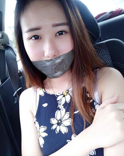 Asian girl fake tape gagged