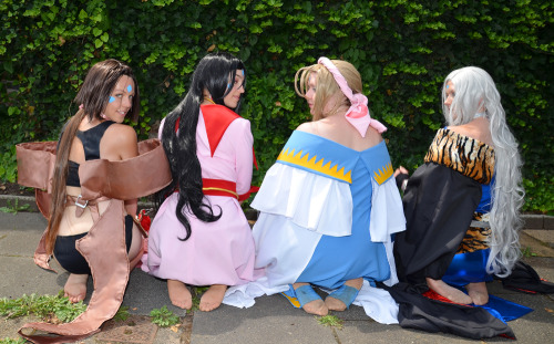Belldandy, Skuld, and Urd cosplayers (with a bare legged Peorth cosplayer).