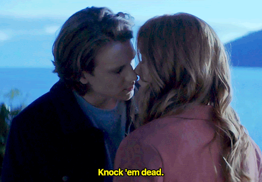 GIF FROM EPISODE 2X18 OF NANCY DREW. NANCY AND ACE ARE STANDING OUTSIDE AT THE BLUFFS. THEY'RE FACE-TO-FACE, THEIR FACES VERY CLOSE TO EACH OTHER. ACE IS LEANING IN WITH HIS EYES CLOSED LIKE HE'S GOING TO KISS NANCY. HE SAYS "KNOCK 'EM DEAD" AND OPENS HIS EYES TO LOOK AT HER.