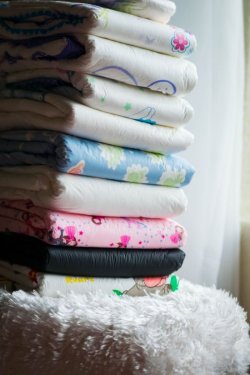 theadventuresofaandk:  All of these pretty, fluffy diapers…. which one am I going to choose for you today?