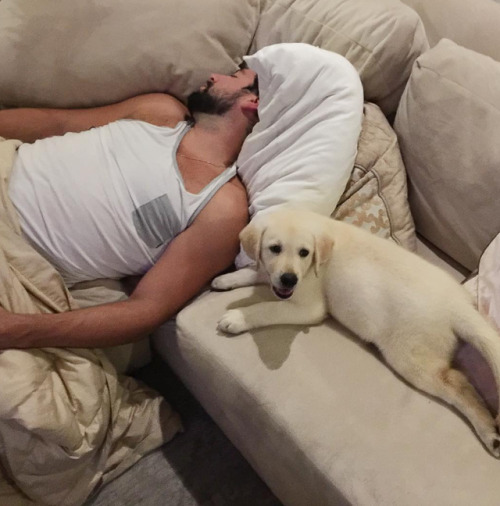 Nate Thompson taking a nap with his puppy, Eddie(Source: instagram.com/good_times_with_eddie)