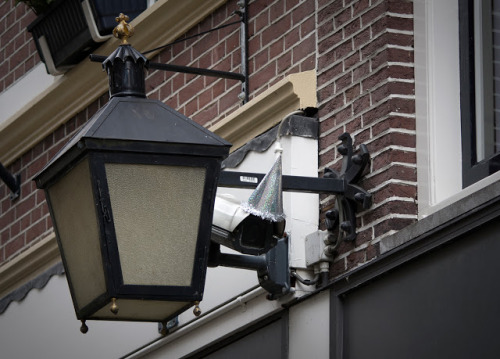 unicorn-meat-is-too-mainstream:  DECORATING SURVEILLANCE CAMERAS WITH PARTY HATS TO CELEBRATE GEORGE ORWELL’S BIRTHDAY