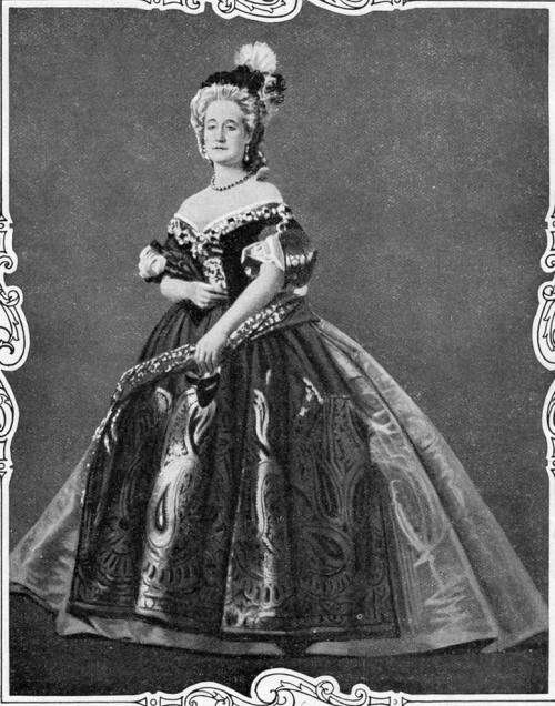 A photograph of the empress Eugenie as Marie Antoinette at a costume ball held at the Tuileries .[source: Gogmsite]