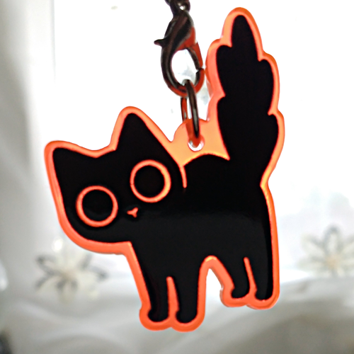 starpatches:Black cat charms on fluorescent orange acrylic!http://starpatches.tictail.com/product/bl
