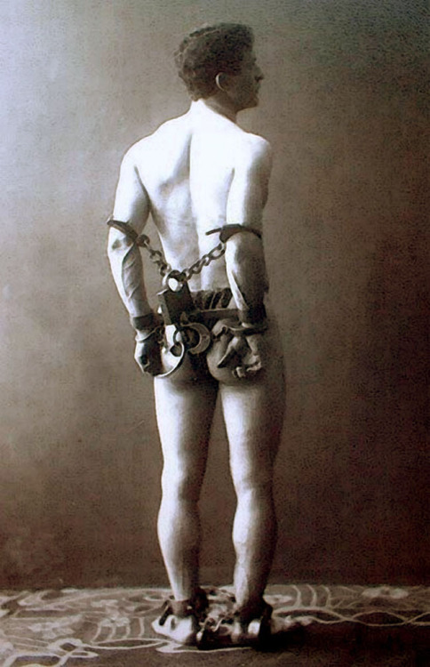 Harry Houdini in chains