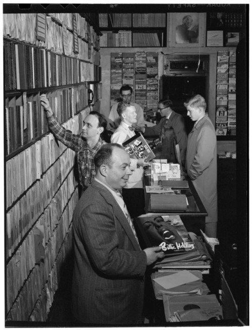 At the Commodore Record Shop in New York, 1947. Note the great cover art on the Billie Holiday and K