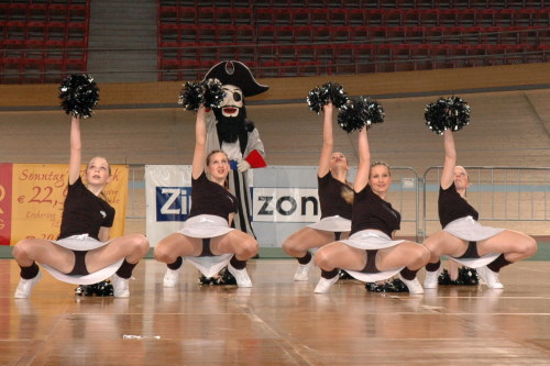 Group of cheerleaders in skin pantyhose with wide open legs.Woman in pantyhose
