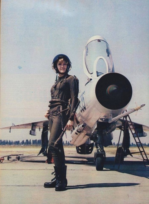 arrogant-bastard-american:  A lady of the Yugoslavian Air Force poses beside her (feel free to correct me if I fuck this up) Sukhoi Su-17.  Looks like a mig-21 but can’t get a gr8 look at the wings