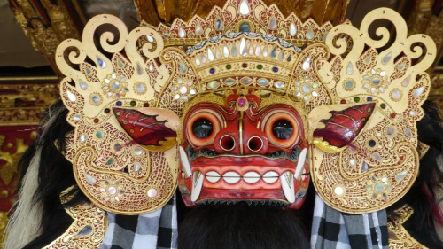 Masks of Barong and Rangda worshiped at balinese temple