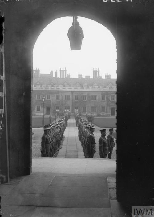 Cadets of No. 5 Officer Cadet Battalion practicing drills in the Great Court, Trinity College, Cambr