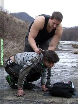 outmanned:   Cowering wimp forced to kiss the mud and clean his tormentor’s boots. Manhandled robbed and left completely shamed at the hands of the superior brute. 