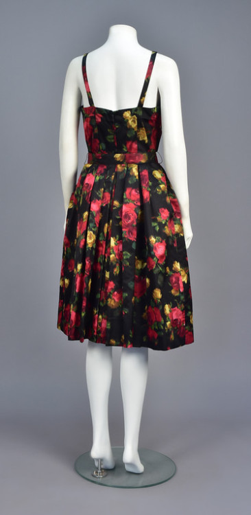 historicaldress: SUZY PERETTE WARP PRINTED COCKTAIL DRESS, 1950s Sleeveless black satin with colorfu