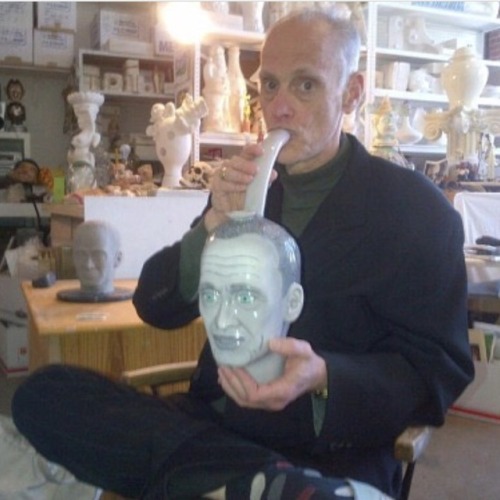 divineofficial:John Waters toking on a John Waters bong.