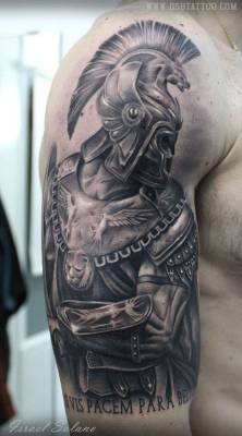 tattoofilter:  Black and grey style roman fighter tattoo, together with the latin quote “Si vis pacem, para bellum”, located on the right upper arm and shoulder. Tattoo artist: Israel Solano