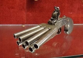 A seven barrel flintlock duckfoot pistol, 18th century.