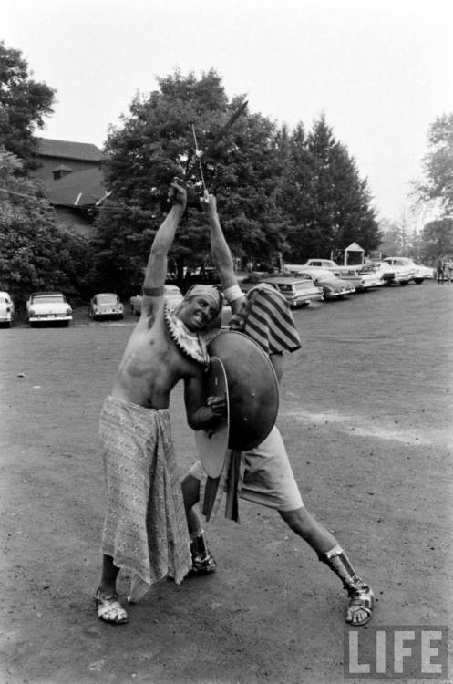 Egyptian extras fighting in the parking lot(Robert W. Kelley. 1959?)