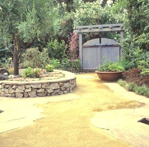 Rustic Landscape - Natural Stone PaversInspiration For A Summertime Mid-sized Rustic Courtyard Stone