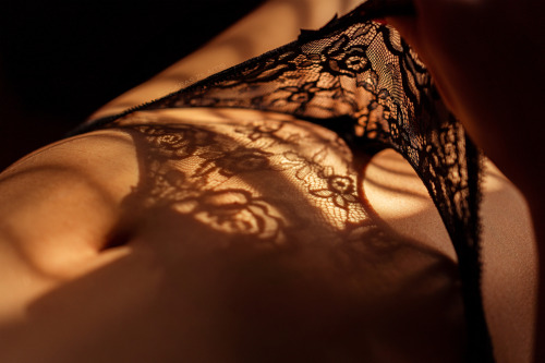 Intimacy by zilaitisClose up shot of models tummy with flower shaped shadows.Edgaras Žilaitis Photog