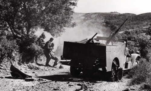 A scout car just rolled on a mine during the Operation Jumelles and wounded men are being rescued. S