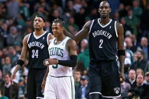 Rajon Rondo keeps a cool smile while Kevin Garnett makes fun with his former teammate.