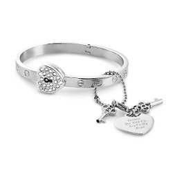 daddysdimples:  oh my gosh I saw this cute lil lockable braceletat a store called Things Remembered. As soon as I saw it, I thought it would be super cute for D/s couples! You can get the tag custom engraved and only the one who holds the key can open