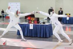 modernfencing: [ID: two epee fencers attacking each other’s shoulders. Only the fencer on the left has actually hit.] Fencing at the 2018 Canada Cup! 
