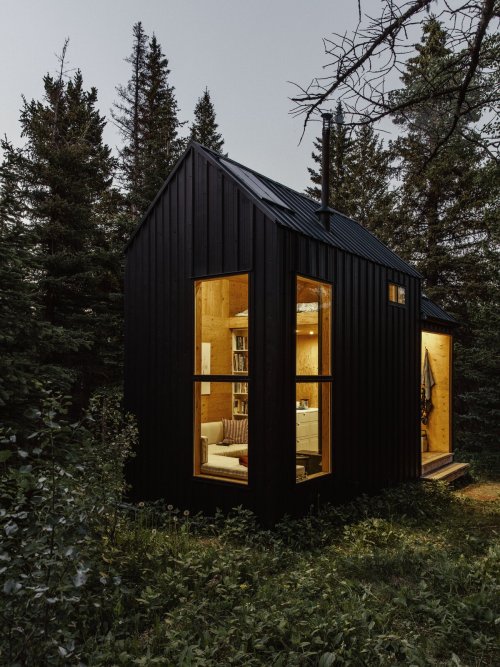 keepingitneutral:    Nathalie and Greg Kupfer’s Micro-Cabin, Canmore, Alberta, Canada,The forested retreat cost the couple Ū,109. Included in the project’s net cost, Nathalie and Greg put out an additional ฤ to build and furnish an outhouse on